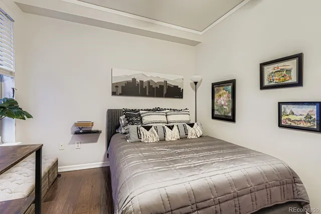 a bedroom with bed and a night stand