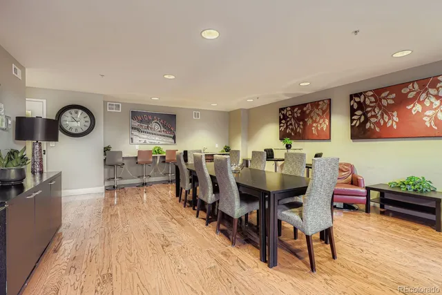 a view of a dining area with furniture and wooden floor