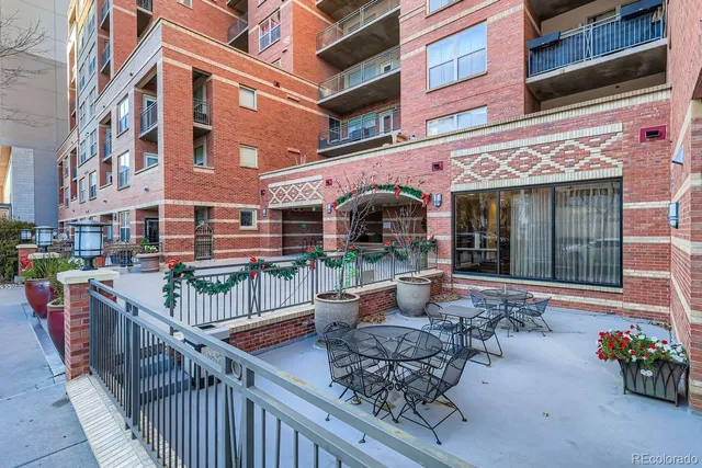 a view of a building with sitting area