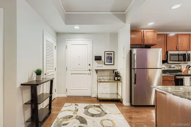 a kitchen with sink cabinets and stainless steel appliances