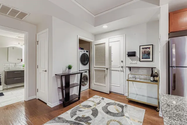 a kitchen with stainless steel appliances granite countertop a refrigerator and a stove top oven