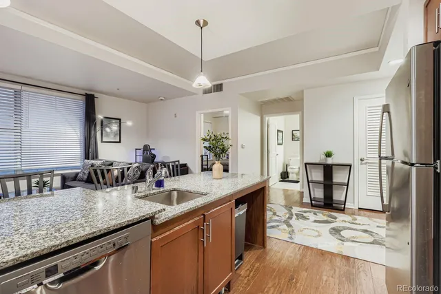 a kitchen with counter top space cabinets and appliances