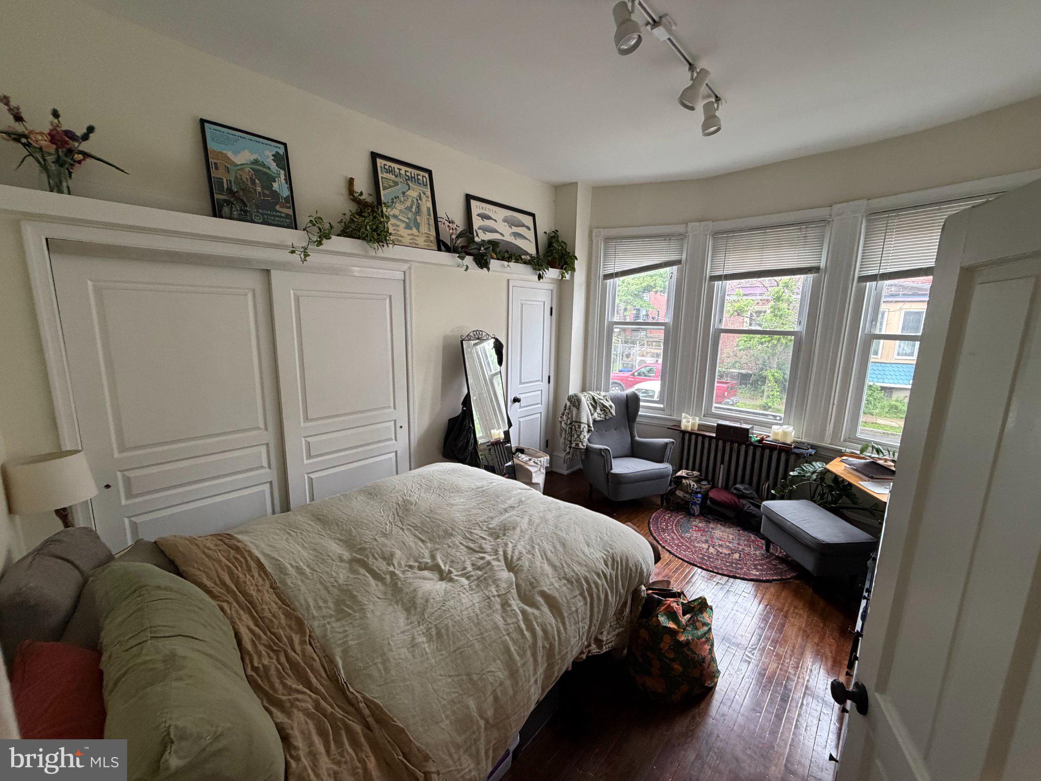 815 South 49th Street Philadelphia, PA 19143 - Photo 12 of 72 a bedroom with a bed couch and a window