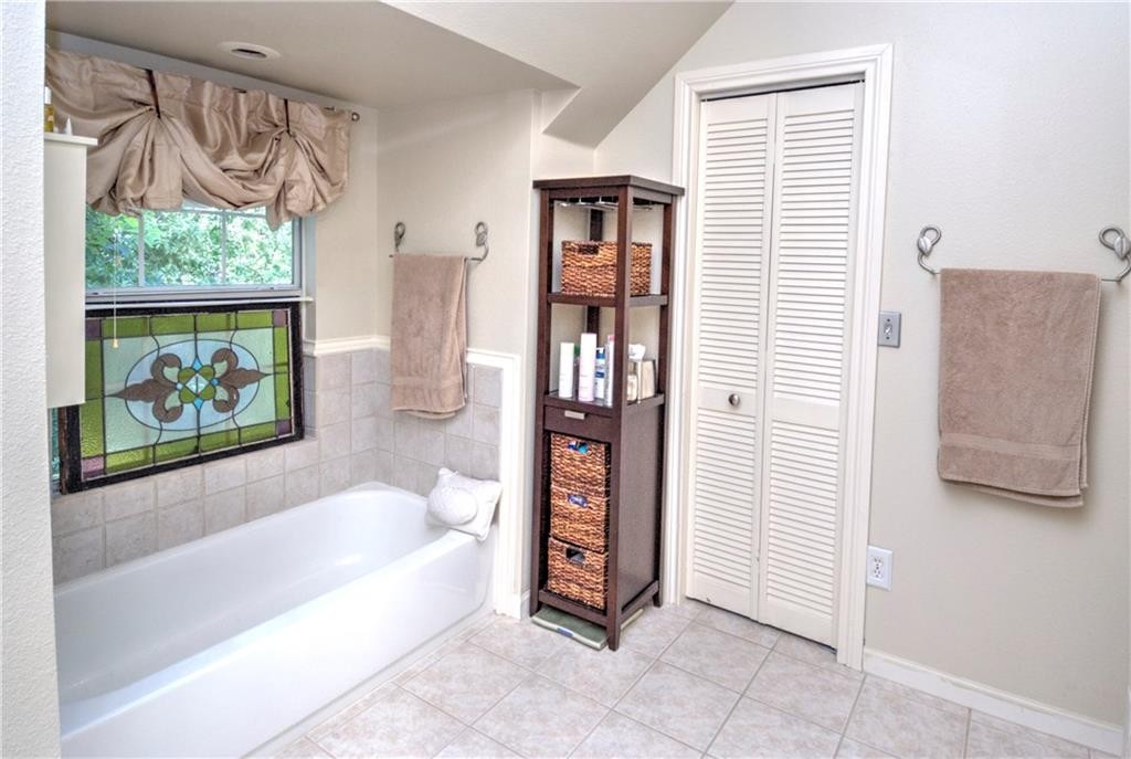 2404 Thornton Road, Unit A Austin, TX 78704 - Photo 16 of 31 a spacious bathroom with a bathtub and a shower