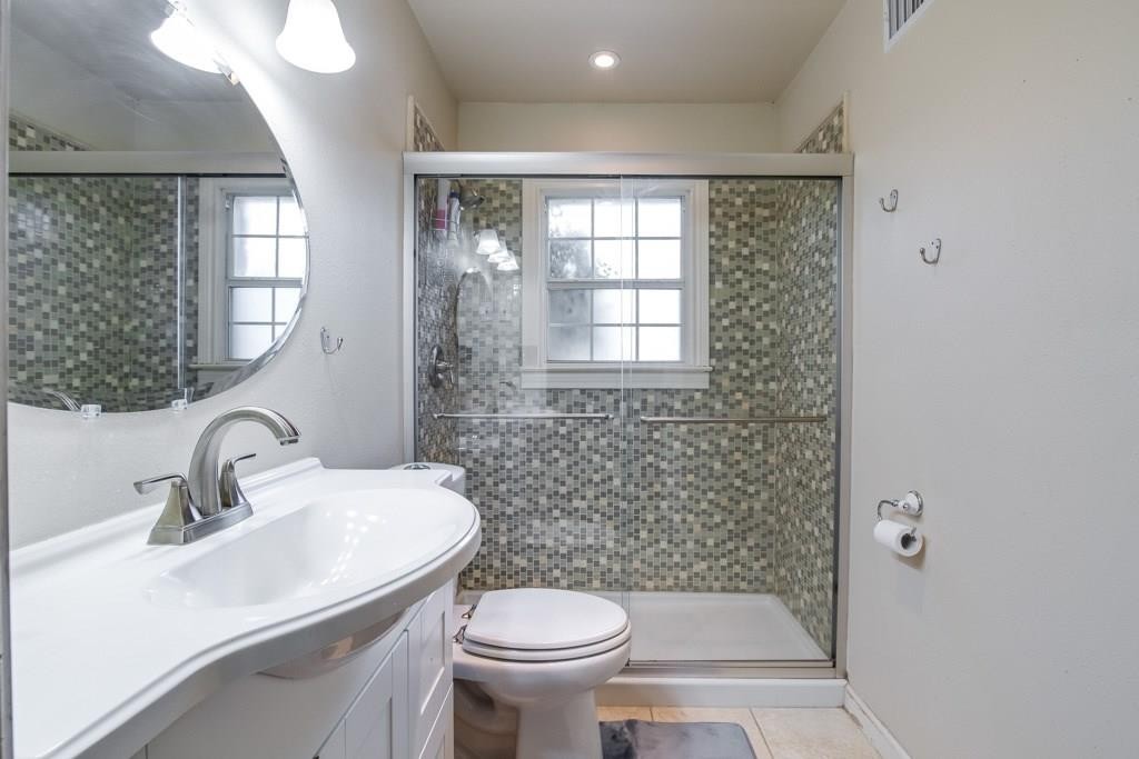 2404 Thornton Road, Unit A Austin, TX 78704 - Photo 18 of 31 a bathroom with a sink toilet and a mirror
