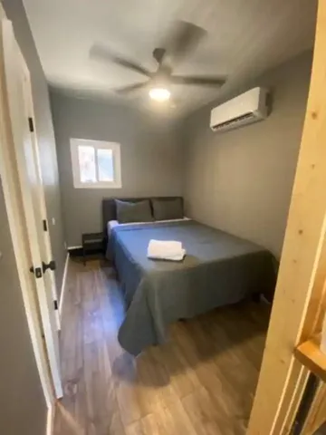 a bed sitting in a room next to a window