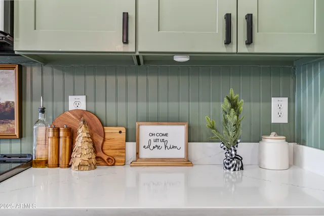 a living room with furniture a table and chairs