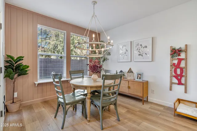 a dining room with a table and a chair