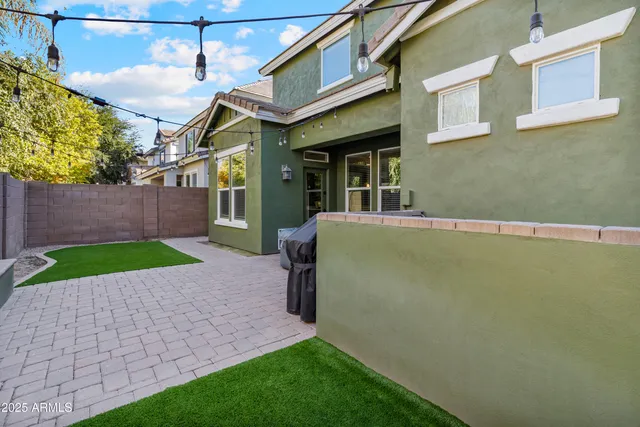 a view of a house with outdoor seating
