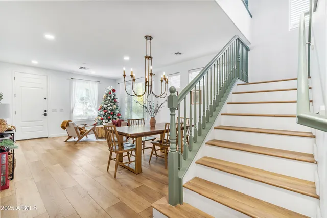 a view of entryway and dining room and hall with wooden floor