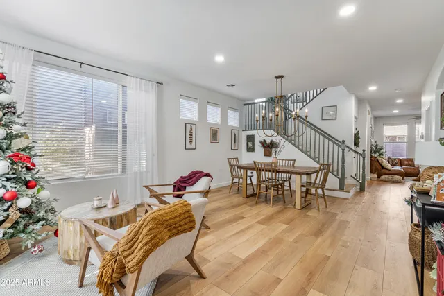 a living room filled with furniture and a chandelier