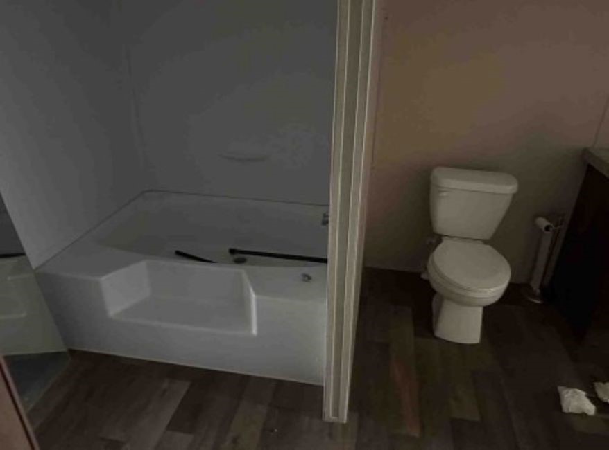 1580 Pooley Road Kingsbury, TX 78638 - Photo 10 of 11 a bathroom with a toilet and a rug