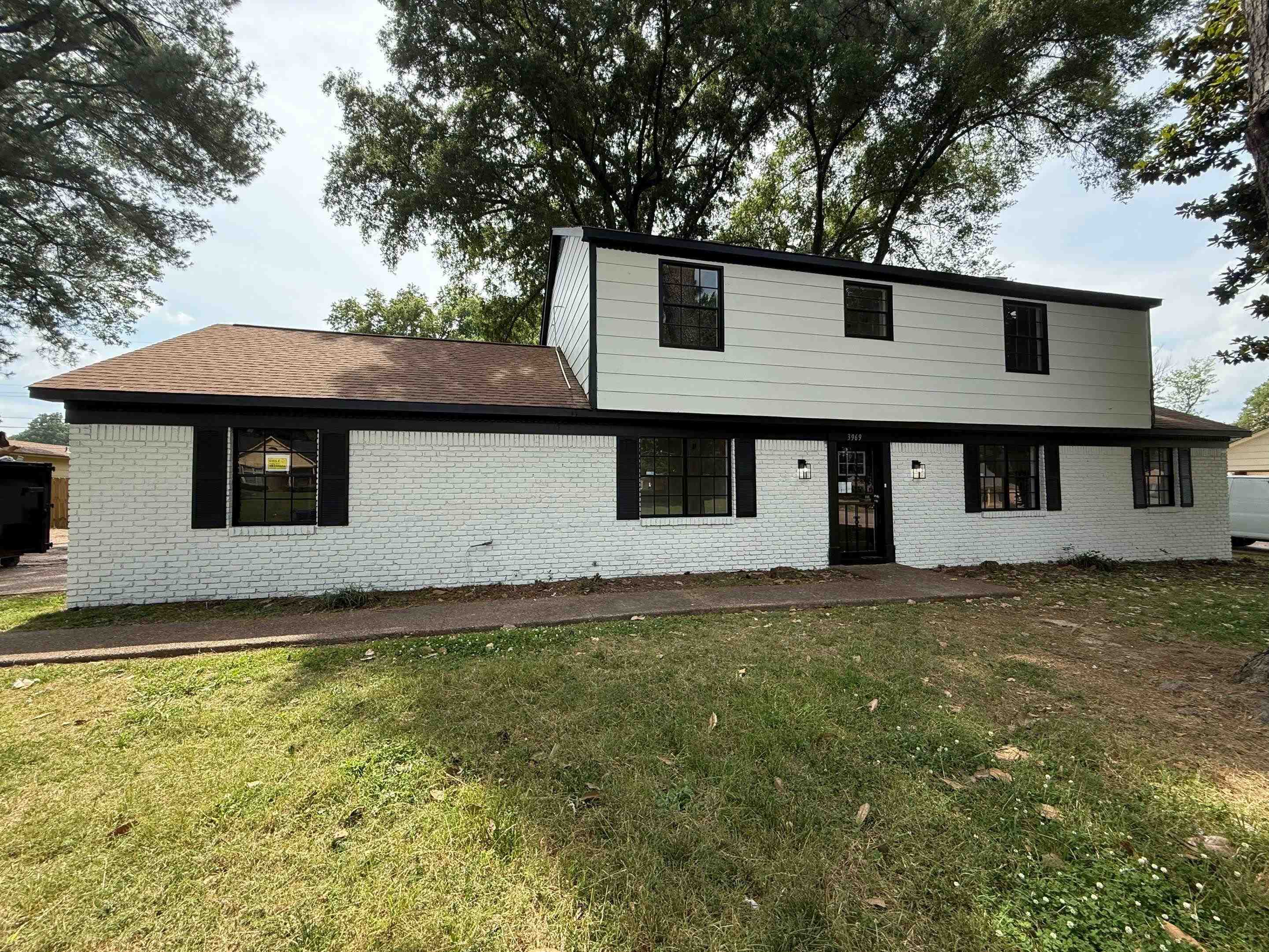3969 Millbranch Road Memphis, TN 38116 - Photo 1 of 33 View of front of home featuring brick siding and a front lawn