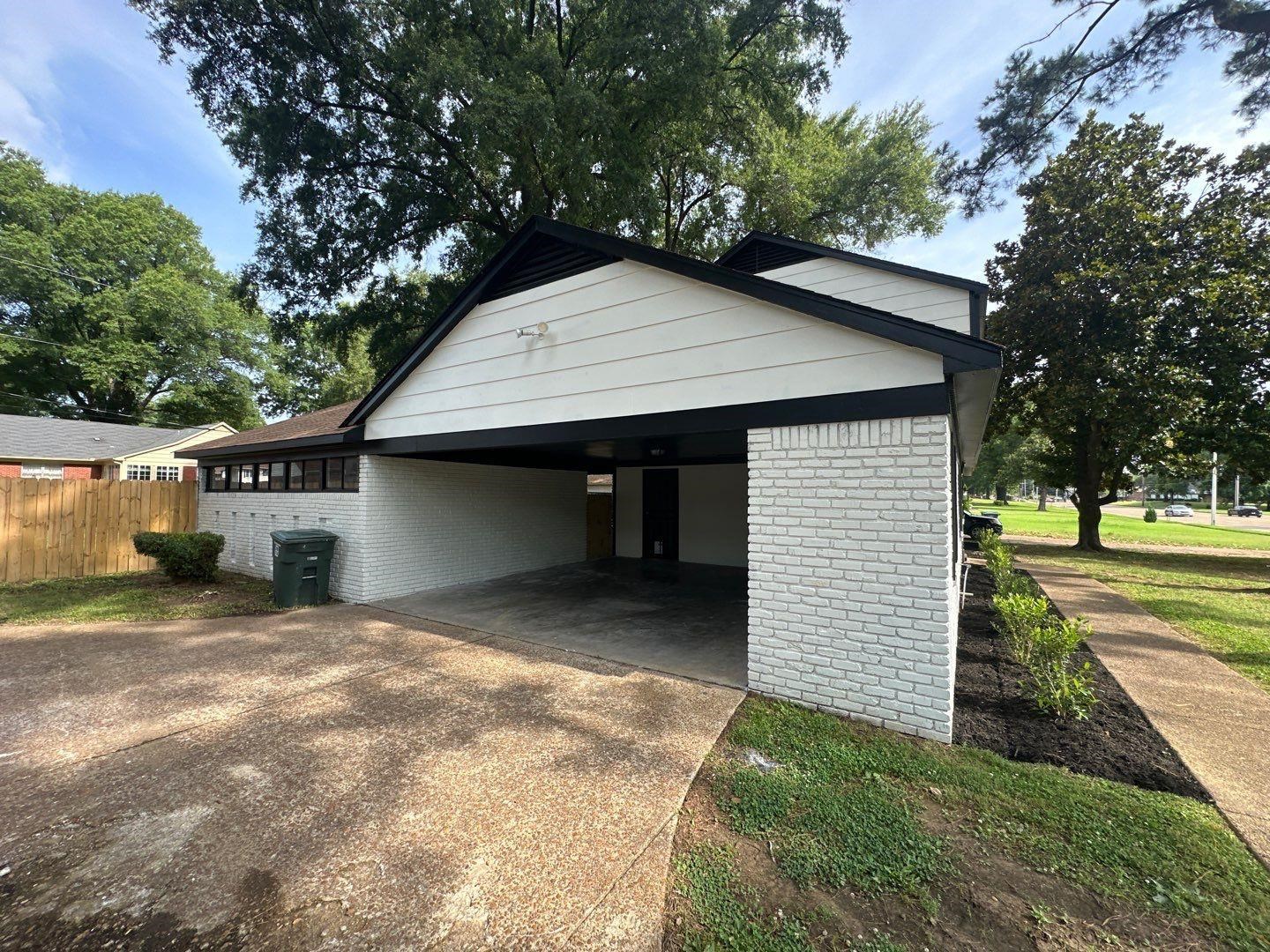 3969 Millbranch Road Memphis, TN 38116 - Photo 2 of 33 Garage featuring concrete driveway and an attached carport