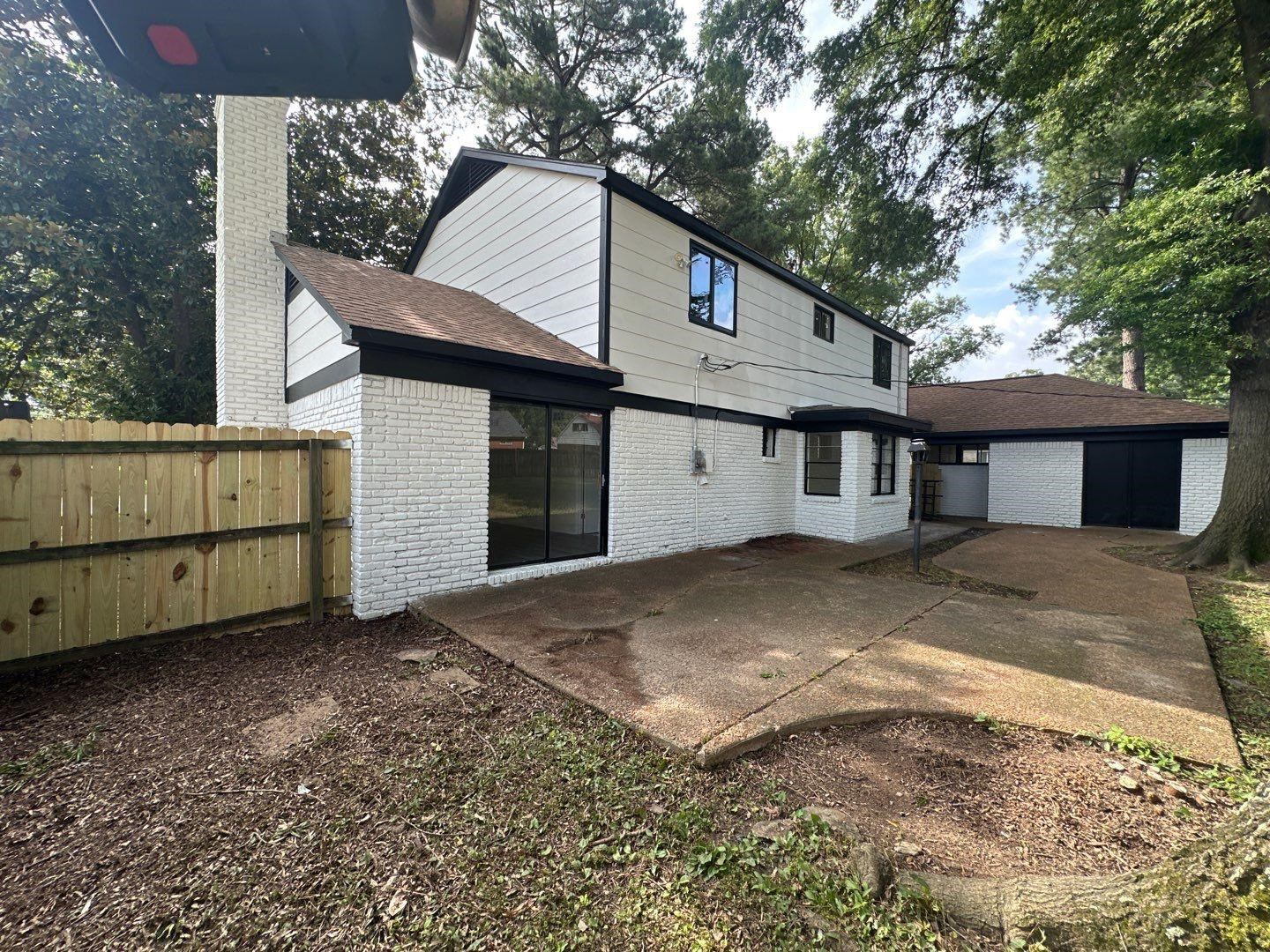 3969 Millbranch Road Memphis, TN 38116 - Photo 32 of 33 Rear view of property with brick siding, a patio, a chimney, and roof with shingles