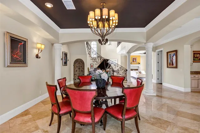 a living room with furniture and kitchen view