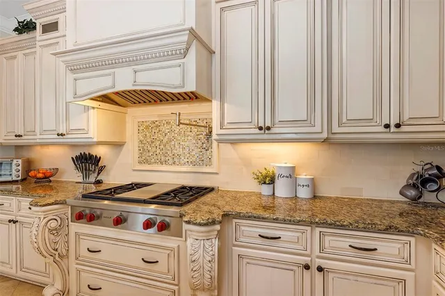a view of a hallway with a dining table & chairs