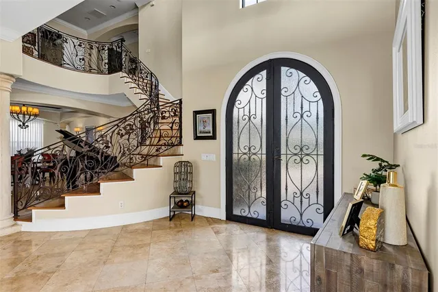 a view of a dining room with furniture and chandelier