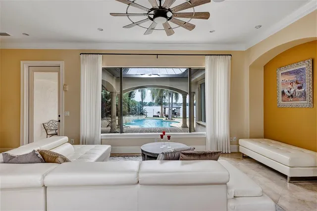 a view of a dining room with furniture and chandelier