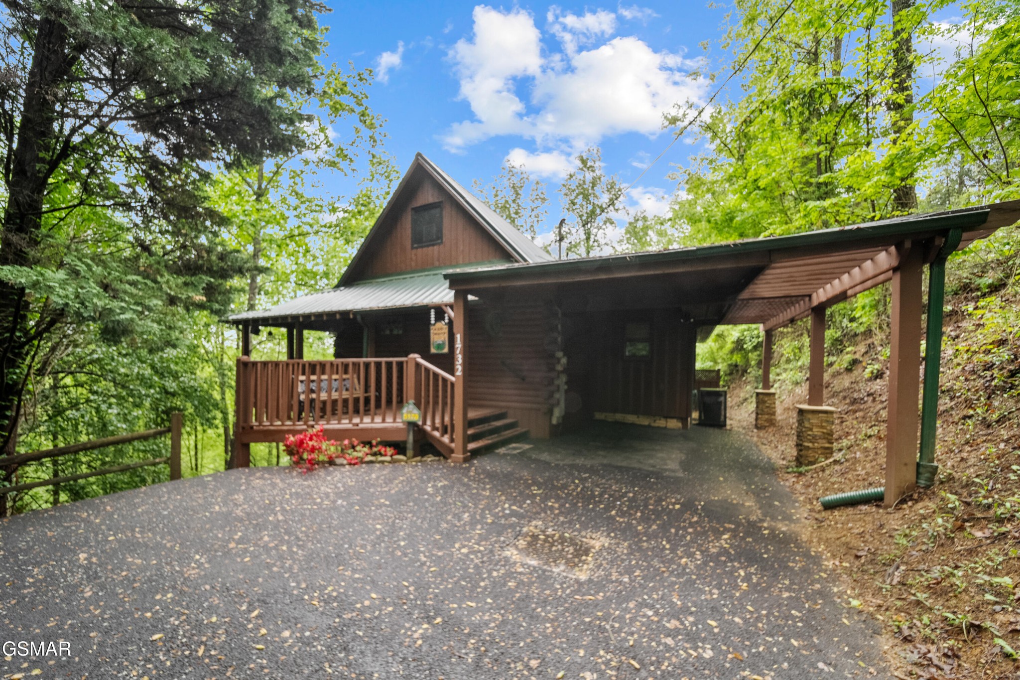 1732 Ridgecrest Drive Sevierville, TN 37876 - Photo 1 of 28 a view of a small house with a small yard and a large tree