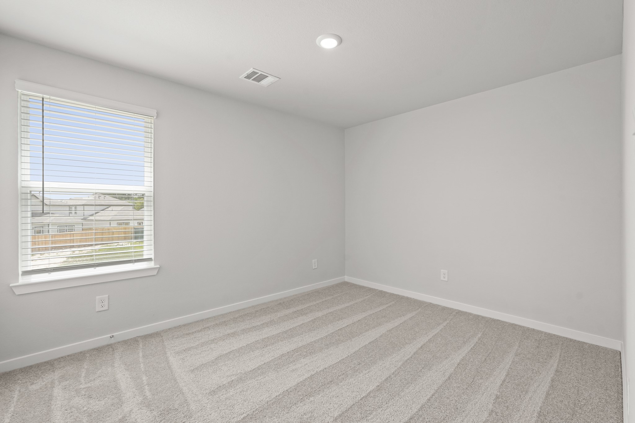 213 Spring Drive Hockley, TX 77447 - Photo 17 of 26 an empty room with a window