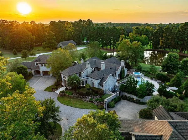 an aerial view of a house with mountain view