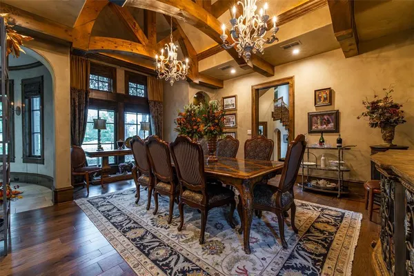 a living room with furniture fireplace and a table