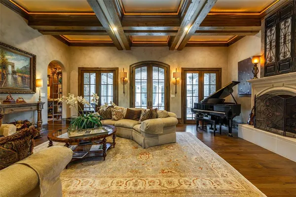 a living room with fireplace furniture and a flat screen tv