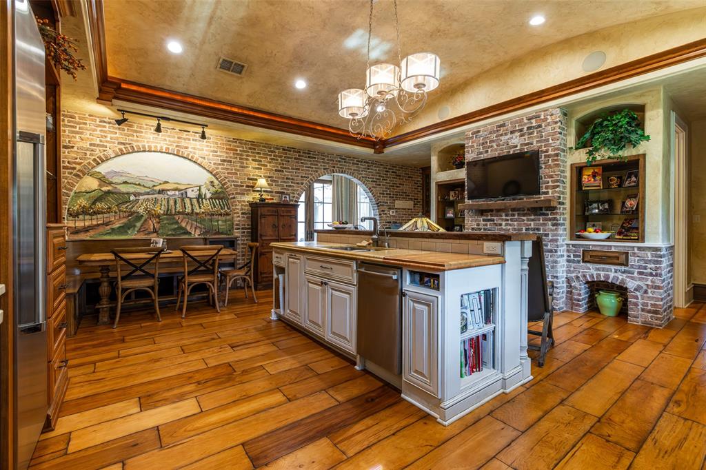 325 Young Road Hallsville, TX 75650 - Photo 14 of 39 a kitchen with stainless steel appliances granite countertop a stove and cabinets
