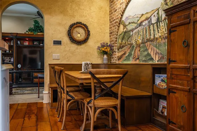 a very nice looking dining room with a large window