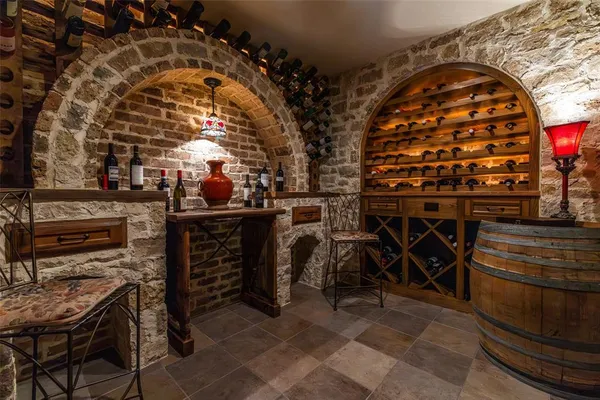 a bedroom with a bed mirror and window