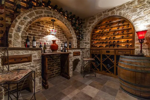 a bedroom with a bed mirror and window