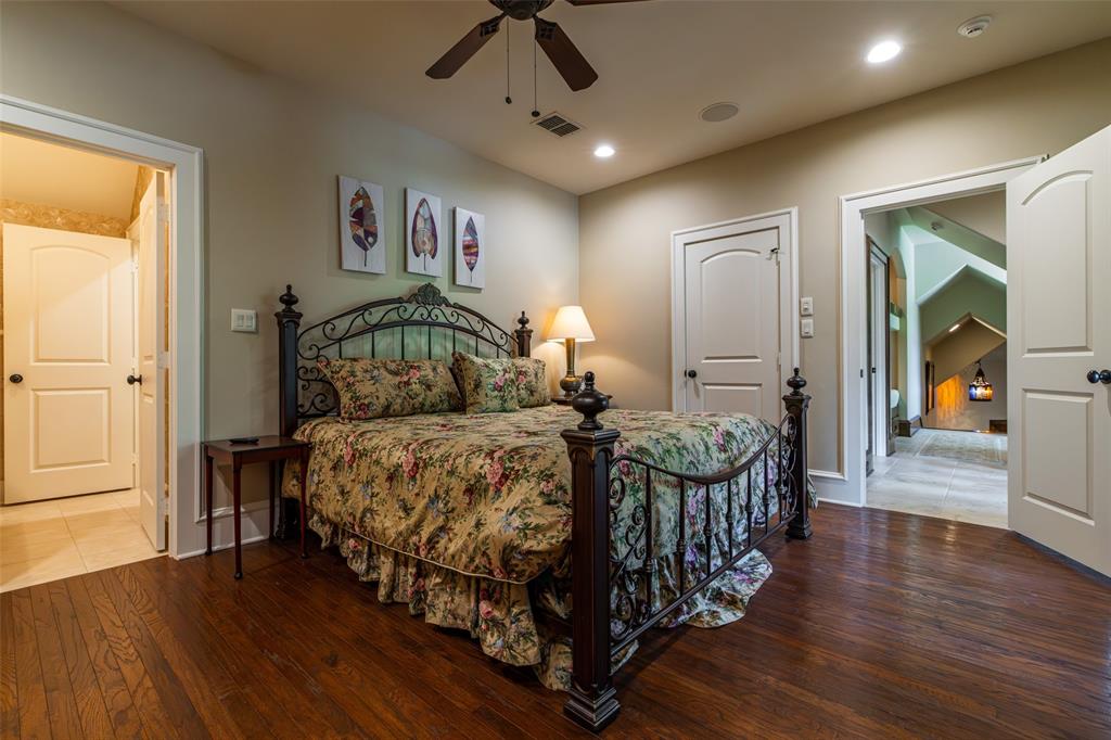 325 Young Road Hallsville, TX 75650 - Photo 22 of 39 a bedroom with a bed mirror and window