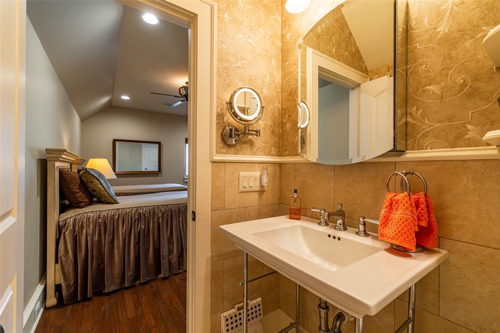 325 Young Road Hallsville, TX 75650 - Photo 24 of 39 a bathroom with a sink and a mirror