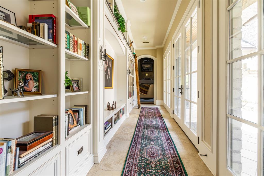 325 Young Road Hallsville, TX 75650 - Photo 28 of 39 a view of a hallway with lots of frames on wall and a window