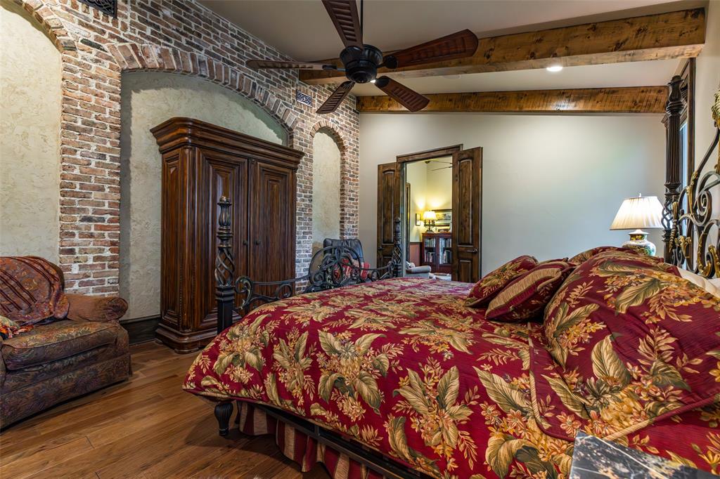 325 Young Road Hallsville, TX 75650 - Photo 29 of 39 a bedroom with a bed and a couch