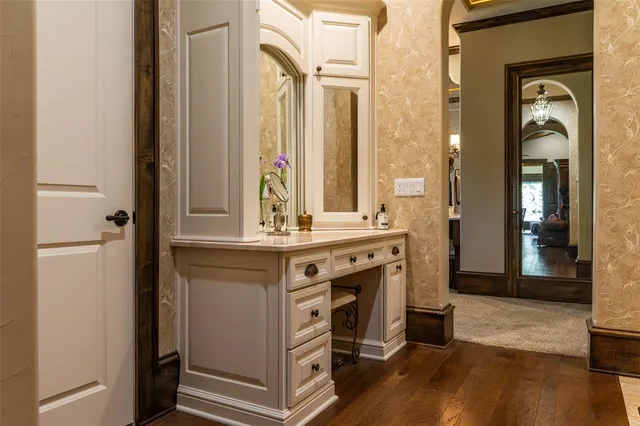 a kitchen with a stove a sink and a window