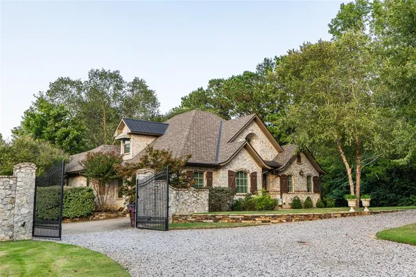a bedroom with a large bed and a tv