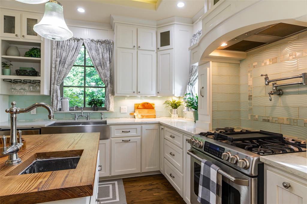325 Young Road Hallsville, TX 75650 - Photo 33 of 39 a kitchen with a stove a sink and a window