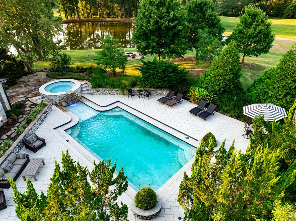 325 Young Road Hallsville, TX 75650 - Photo 37 of 39 a view of a swimming pool with outdoor seating