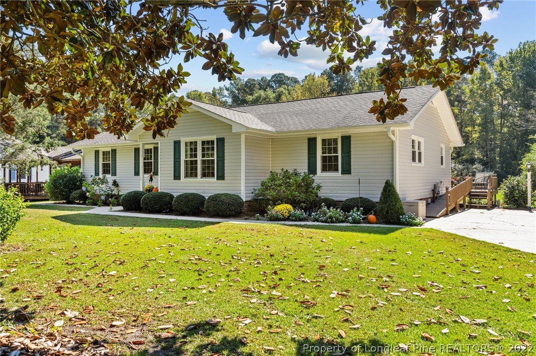 1533 Carl Freeman Road Stedman, NC 28391 - Photo 1 of 48 a view of a house with swimming pool and porch