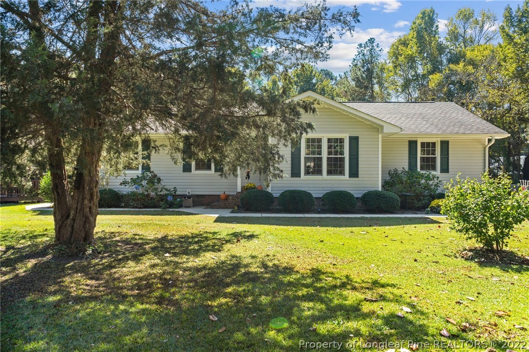 1533 Carl Freeman Road Stedman, NC 28391 - Photo 14 of 48 a view of a house with swimming pool and a yard