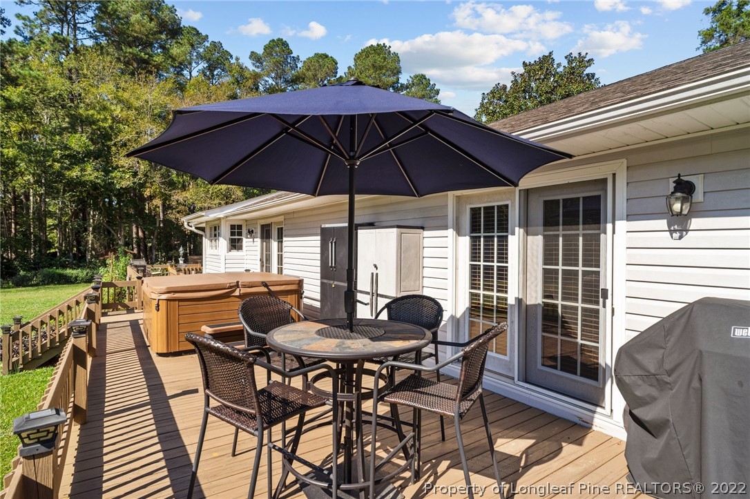 1533 Carl Freeman Road Stedman, NC 28391 - Photo 18 of 48 a view of an outdoor sitting area with furniture and backyard