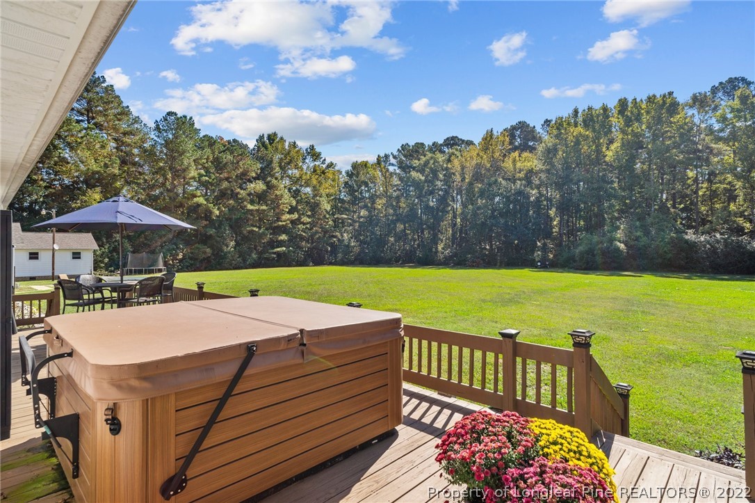 1533 Carl Freeman Road Stedman, NC 28391 - Photo 20 of 48 a view of a house with swimming pool and sitting area