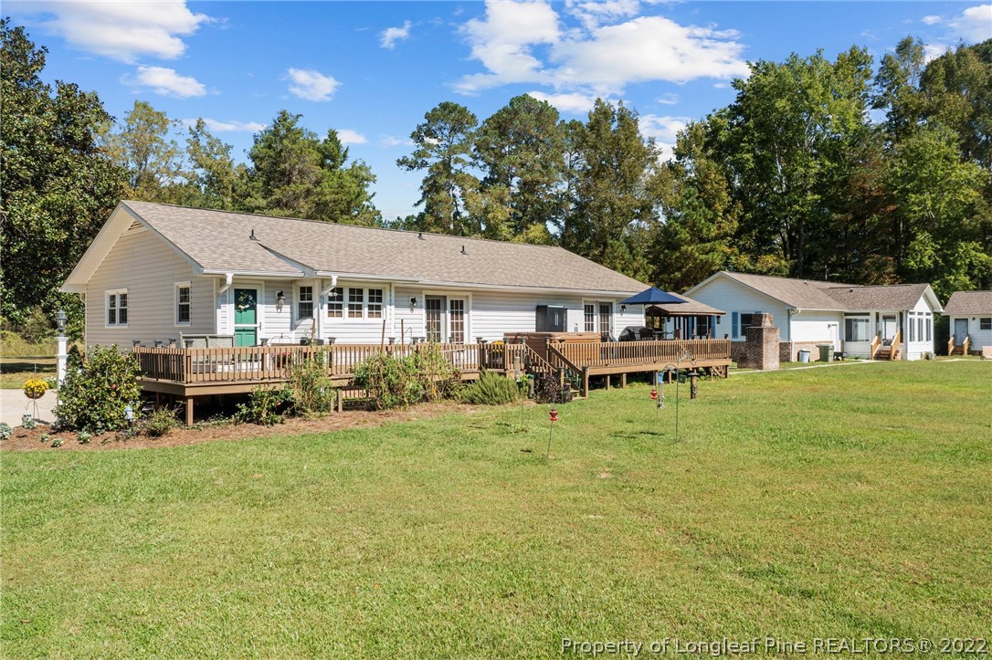 1533 Carl Freeman Road Stedman, NC 28391 - Photo 3 of 48 a white house covered with tall trees