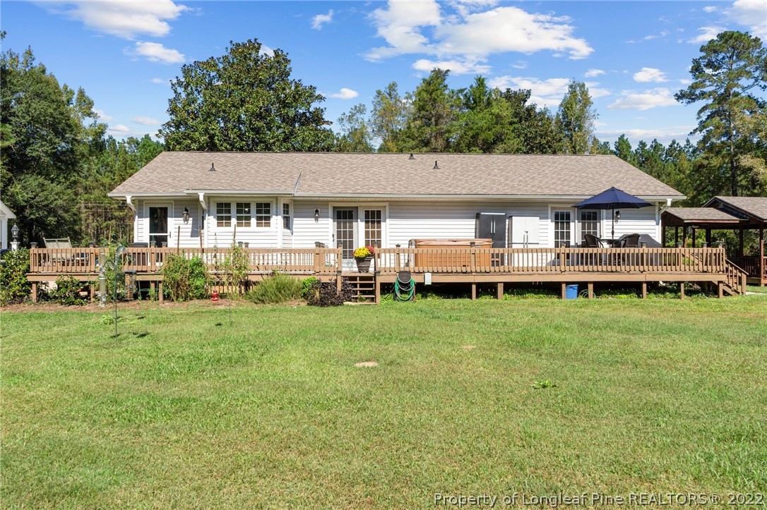 1533 Carl Freeman Road Stedman, NC 28391 - Photo 4 of 48 a view of a house with a backyard