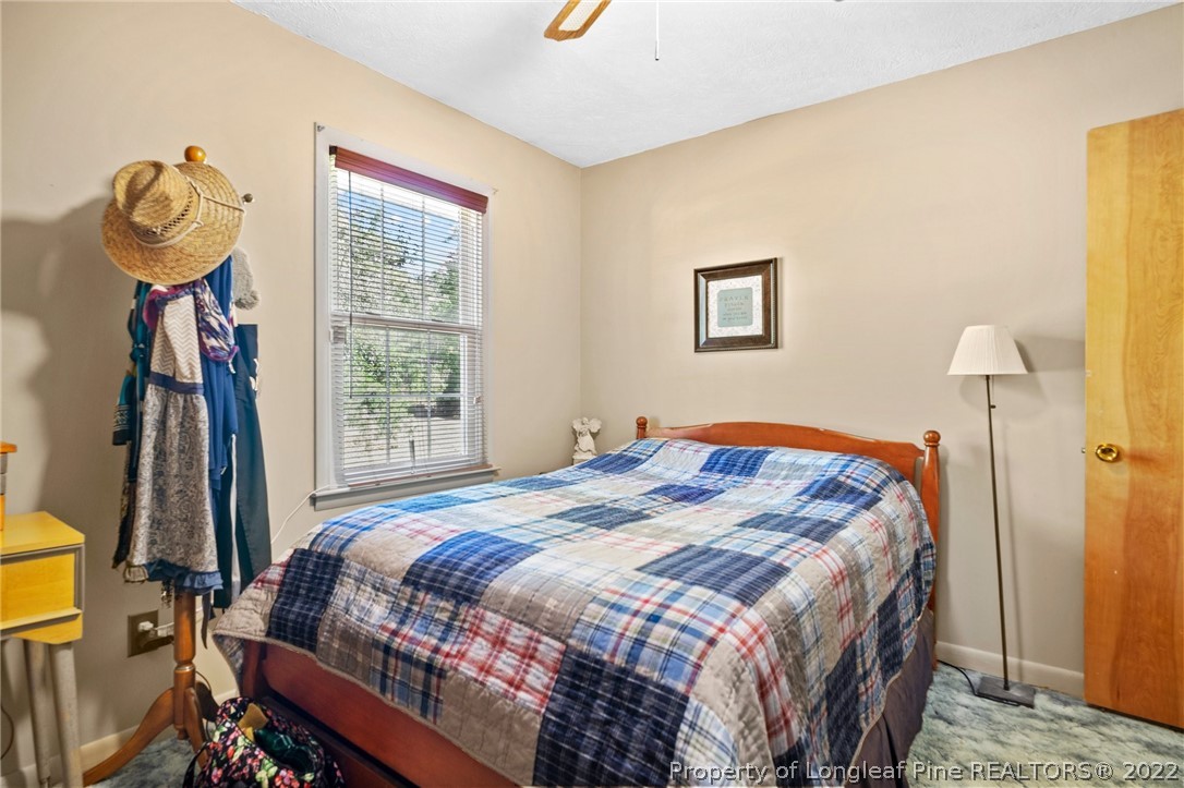 1533 Carl Freeman Road Stedman, NC 28391 - Photo 41 of 48 a bedroom with a bed and a window