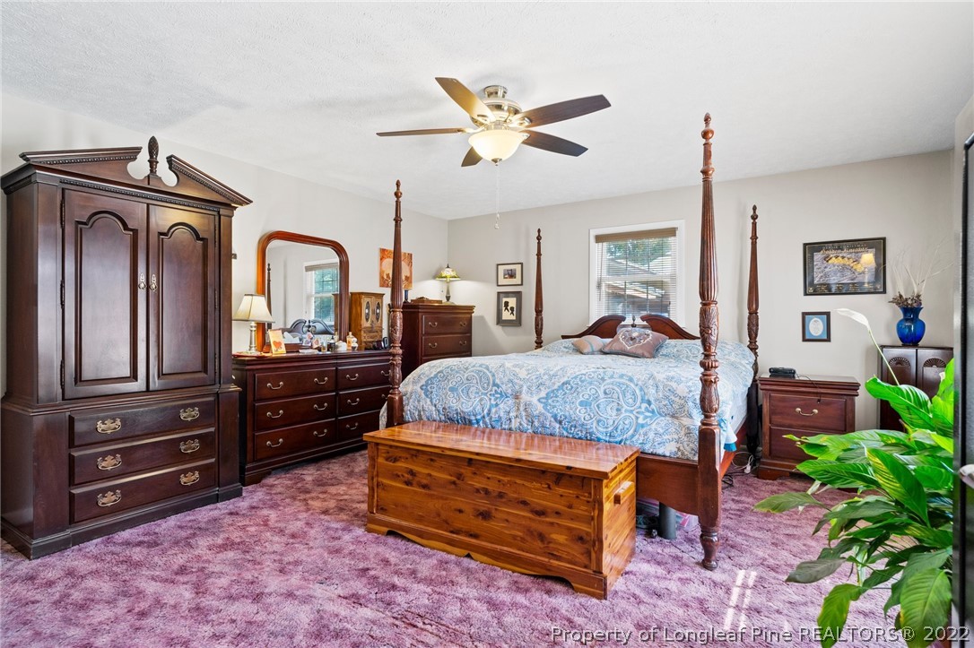 1533 Carl Freeman Road Stedman, NC 28391 - Photo 46 of 48 a bedroom with a bed and a dresser