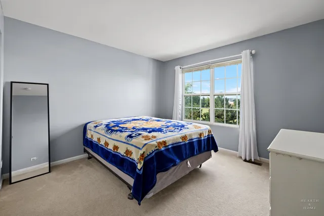 a bedroom with a bed and window