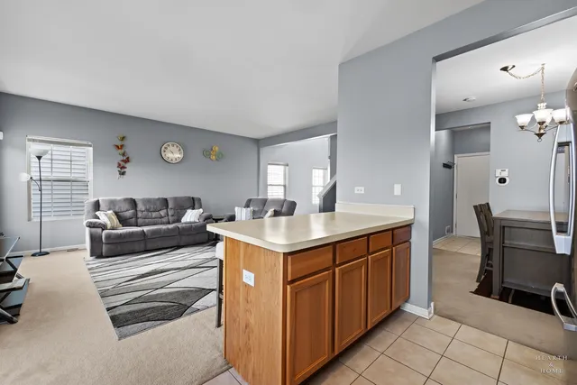 a living room with furniture a table and chairs